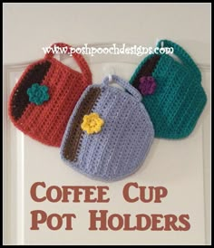 three crocheted purses are hanging on the door with words coffee cup pot holders