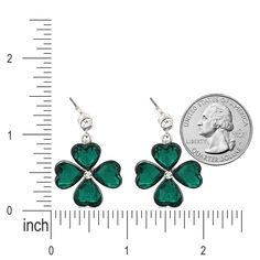 Accessorize for luck and style with our St. Patrick's Lucky Clover Dangle Earrings. These elegant silver-tone earrings feature green glass stones shaped like a four-leaf clover, offering both a symbol of good fortune and a vibrant accessory for any outfit. Ideal for holiday festivities or as a charming gift, they're a festive addition to any jewelry collection. Color: Silver, Green, Clear Material: Crystal Rhinestones, Metal Casting, Rhodium Plated Dimensions (Size): Approx. 1.4" Drop x 0.9" W ( Clover Charm, Four Leaves, Lucky Clover, Four Leaf Clover, Metal Casting, Charm Gift, Clover Leaf, Holiday Festival, Crystal Rhinestone