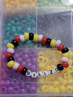 the beads are arranged in different colors and shapes to make a name bead bracelet