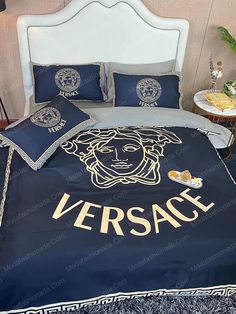 a bed with versa on it in a room