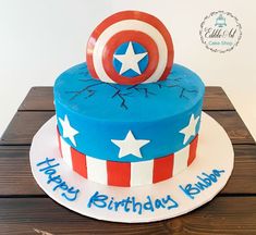 the birthday cake is decorated with captain america's shield and stars, which are on top of each other