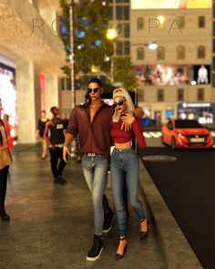 a man and woman walking down a street at night