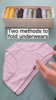 a person is making t - shirts with their hands and sewing threads on the table