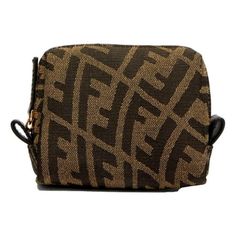 This small Fendi beauty pouch is perfect for weekend travel, to toss in your tote for a day out, or keep beauty essentials organized at work. The durable canvas featuring the FF vertigo pattern in neutral colors provides a fun but casual look for on the go. Model: 8N0179 Canvas Fendi FF Vertigo pattern Light gold-tone hardware Zip closure Zipper pull tab Measurements: 4.75" x 4" x 2.25" (LWH) Includes authenticity cards and dustbag Made in Italy Color: Brown.  Gender: unisex.  Age Group: adult. Organized At Work, Beauty Pouch, Weekend Travel, Work Organization, Handbag Wallet, Brown Coat, Travel Beauty, Brown Canvas, Wallet Accessories