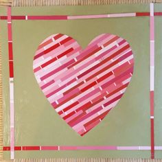 a heart made out of strips of paper