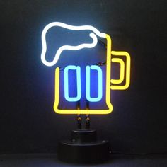 a neon beer sign is lit up in the dark with two mugs on it