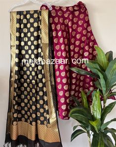 Soft and flowy Banarsi satin silk lehenga/skirt with a big flare and a coordinating Banarsi dupatta. Skirt length: 40 inches. Skirt waist: fits up to 38 inches. Dupatta: 96 by 34 inches. Color: Black and Wine Floor-length Banarasi Silk Sharara For Festive Occasions, Art Silk Floor-length Sharara With Unstitched Blouse, Festive Black Chanderi Lehenga, Choli With Zari Work And Long Skirt For Eid, Eid Long Skirt Traditional Wear With Dupatta, Diwali Dupatta With Unstitched Blouse, Eid Long Skirt With Dupatta, Eid Traditional Wear With Dupatta And Long Skirt, Traditional Drape Skirt For Eid