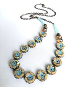 I used small cream-colored flower beads with mint-blue highlights mixed with muted browns for this necklace.  The flowers are fun and funky for all ages - any time of year.  The metal I use is natural brass. It is nickel-free, lead-free compliant and made in the USA - Hooray! The total length is 25 inches - it is finished in a lobster claw clasp.  Enjoy! Glass Bead Jewelry, Blue Highlights, Glass Beads Jewelry, Mint Blue, Flower Beads, Brass Necklace, Bead Jewelry, Czech Beads, Handmade Necklace