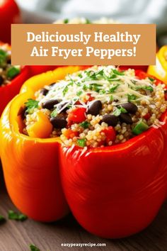 Three colorful bell peppers stuffed with quinoa, black beans, and fresh herbs on a wooden surface. Stuffed Bell Peppers With Quinoa, School Cookies Recipe, Quinoa And Black Beans, Stuffed Bell Peppers Recipe, Black Beans Recipe, Easy Zucchini Recipes, Healthy Air Fryer, Black Bean Recipes, Easy Peasy Recipes