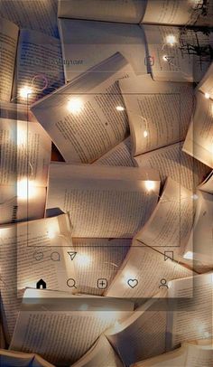 many open books with lights on them in the shape of a rectangle and surrounded by smaller ones