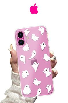 a person holding an iphone case with ghost stickers on it