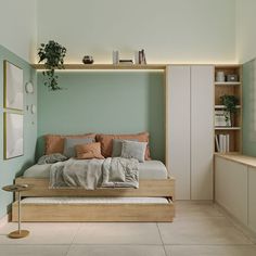 a bed sitting in the middle of a bedroom next to a shelf filled with books