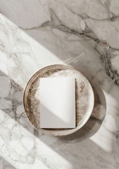 an empty white paper on a marble plate