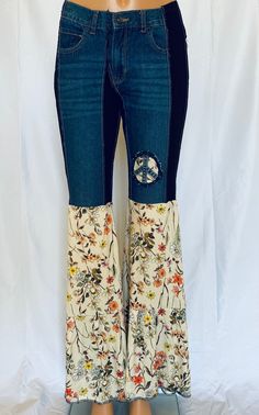 The most comfortable jeans you'll ever wear. One of a kind jeans with the Mama Mia ruffle will turn heads. Comfort and funky hippie style. Embellished with denim peace sign. These get noticed. SIZE XXS-L. You will need to size down. XXS - 0-4 XS-6-8 S- 8-12 M-12-14 L-16-18 Bohemian Dark Wash Bottoms For Fall, Bohemian Stretch Jeans For Spring, Bohemian Dark Wash Jeans For Fall, Hippie Denim Bottoms For Fall, Bohemian Medium Wash Flare Jeans For Fall, Bohemian Flare Jeans In Denim Blue For Fall, Bohemian Flare Jeans In Medium Wash For Fall, Bohemian Mid-rise Cotton Flare Jeans, Bohemian Mid-rise Flare Jeans For Spring