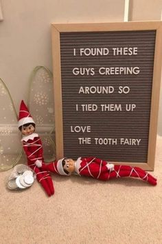 an elf is sitting next to a sign that says i found these guys creeping around so i tried them up love the tooth fairy