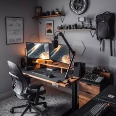 a computer desk with two monitors on top of it