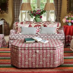 a living room filled with furniture and flowers