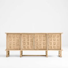 the sideboard is made out of wood and has an intricate design on it's sides