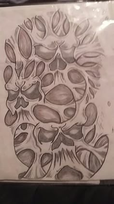 a drawing of an animal's head with leaves on it