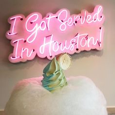 a pink neon sign that says i got served in houston on top of a cloud