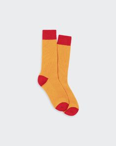 Colorful, cozy socks featuring a contrast color block design in warm tones of orange and red. Soft Socks, Inner Mongolia, Soft Sock, True Red, Mongolia, Sierra Leone, Uganda, Contrasting Colors, Color Blocking