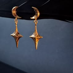 Ready to party? These Moon and Star Gold Asymmetrical Dangle  Earrings are your perfect accessory. Inspired by art-deco, these bright, bold, and dainty earrings are always invited to any event. With their minimalist celestial aesthetic, they add a touch of elegance and sophistication to your look. Enjoy the compliments they bring! ✦ Pair of asymmetrical Gold plated sterling silver earrings  ✦Carefully made with recycled silver in our workshop  ✦ The long-lasting gold plating method is safe for b