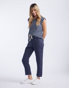 DESCRIPTION Introducing the Luxe Linen Pants in Washed Navy by Little Lies, a chic and versatile staple for your wardrobe. Crafted from premium linen, these pants offer a relaxed fit with a flattering high waist, cinched with a contrasting drawstring for an adjustable and secure fit. The rich ink hue brings a sophisticated touch, making them ideal for casual wear or dressing up. Pair these pants with a Little Lies knit and sneakers for a comfortable and coordinated look, or dress them up with a crisp white tee and heels for a refined outfit. Whether you're heading out for errands or meeting friends for lunch, the Luxe Linen Pants provide both comfort and effortless style. Still browsing? Discover our full range of women's clothing. FEATURES & FIT High-waisted with a relaxed fit Made from p Refined Outfit, Crisp White Blouse, Meeting Friends, White Tee, Linen Pants, Linen Fabric, Effortless Style, Fabric Care, Denim Skirt