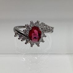 8x6mm Oval Lab Created Red Ruby Stone with bypass Design Surrounded by Zircon Classic Design & Very Traditional Red Cubic Zirconia Birthstone Ring As Gift, Oval Ruby Ring With Cubic Zirconia For Anniversary, Oval Cubic Zirconia Ring For Valentine's Day, Oval Red Gemstone Birthstone Ring, Oval Ruby Birthstone Ring With Cubic Zirconia, Oval Cubic Zirconia Birthstone Ring Gift, Oval Ruby Crystal Ring As Gift, Oval Ruby Ring For Anniversary, Red, Oval Ruby Crystal Ring For Anniversary