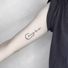 a woman's arm with a tattoo that reads, love and heartbeat on it