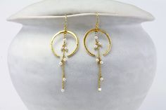 These ornate, moon-like crescent drop earrings feature intricate Freshwater Pearls, set in 18KT Gold Vermeil. They were lovingly handcrafted and have beautiful movement.  If you are searching for meaningful birthstone gifts or an elegant anniversary gift, this is the perfect gift for her. Pearl is the birthstone for June. Birthstone Jewellery is a wonderful personalised gift to give and receive. The earrings have a 65mm drop and come with hook backs. Designed in our Devon studio, our earrings ar Gold Moon Earrings, Silver Gift Box, Gold Pearl Earrings, Gold Moon, Birthstone Gifts, June Birthstone, Moon Earrings, Gold Drop Earrings, June Birth Stone