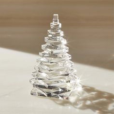 a crystal christmas tree sitting on top of a table