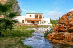 a house with a small stream running through it