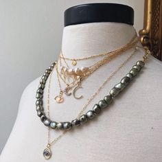 The Hudson is the most versatile piece we have at RM! Dark green olive pearls and gold chain, with a gold lobster clasp and a green crystal detail. Can be worn as a wrap bracelet or as a necklace in multiple ways. As a lariat, as a short pearl necklace, or at a longer length. Green Olive, Green Crystal, Green Crystals, Gold Chain, Wrap Bracelet, Gold Chains, Lobster Clasp, Dark Green, Olive Green