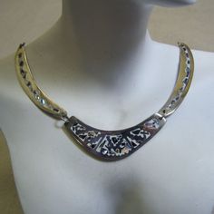 This handsome multi piece necklace features the incredible work of the Mexican metalsmiths. It is made of alpaca metal which looks like silver and wears like iron. The metal is an alloy with zinc, copper and sometimes nickel. The inlay work is lustrous pieces of abalone shell which are the color of a stormy sky but radiate colors of blue, green and pink. The background is white enamel in the metal which makes this a perfect spring or summer necklace. The necklace measures 17 inches long and each Unique Silver Etched Necklaces, Artisan Silver Etched Necklace, Artistic Engraved Silver Necklaces, Artisan Silver Engraved Necklaces, Artistic Oxidized Silver Necklace, Adjustable Bronze Sterling Silver Necklace, Silver Etched Pendant Necklace, Silver Brass Jewelry With Unique Design, Bohemian Etched Silver Necklace