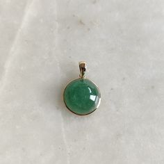 ITEM DESCRIPTION: >> The pendant is made from Solid 14K Yellow Gold. Gemstone used is absolutely natural and ethically sourced. >> Natural Green Aventurine in cabochon cut and round shape with bezel setting is studded on it with utmost precision. >> This is a minimalist design and is absolutely hassle-free and everyday jewelry. Gem: Aventurine Gem size: 15 x15 mm round Gem weight: 10.70 carats Gold purity: 14K (58.33% approx.) Gold weight: 0.53 grams Gross weight: 2.67 grams The Gold purity is g Expensive Rings, Handmade Jewelry Box, August Birthstone, Bezel Pendant, August Birth Stone, Green Amethyst, Gold Pendant Necklace, Green Aventurine, Everyday Jewelry