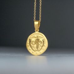 Solid gold ancient Greek coin necklace, inspired by the 5th century BC Delphi coin (Phokis). There is an image on both sides and can be worn either way. It pictures two rhyta (drinking vessels) in the form of ram's heads, above, two dolphins are swimming toward each other; ΔAΛΦ-I-KON in small letters below on the other side, the backside, it pictures a Quadripartite incuse square in the form of a coffered ceiling; each coffer decorated with a dolphin and laurel spray. This is a replica of an anc Symbolic Yellow Gold Coin Medallion Necklace, Symbolic Yellow Gold Coin Necklace, Yellow Gold Symbolic Engraved Coin Necklace, Symbolic Yellow Gold Coin Pendant Necklace, Symbolic Yellow Gold Plated Coin Necklace, Symbolic Gold Plated Coin Necklace In Yellow Gold, 14k Gold Amulet Coin Necklace Tarnish Resistant, 14k Gold Round Pendant Amulet Coin Necklace, Yellow Gold Amulet Coin Necklace