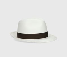 The Federico Panama Fine has a 6cm medium brim and 3cm grosgrain logo hatband. The production of Borsalino straw hats begins in Ecuador, where the local straw is harvested from the stalks of the toquilla palm tree, boiled and dried under the sun. A process that can take up to six months. The skilled Ecuadorian artisans weave by hand, making extremely fine semi-finished cloches. After careful quality control, the cloches are sent to the Alessandria maison for the continued rigorous and intricate manufacture processes. Then once the ribbon is added, the brim is stiffened before the hat is ready for the final steps: embellishments, stitching, inspection and packaging - all finished by hand. The history of the Panama hat is intriguging. Wear your Federico Panama Fine hat and be part of history White Fedora For Summer Formal Events, White Fedora For Formal Summer Occasions, White Fedora For Formal Summer Events, White Summer Fedora For Formal Occasions, Formal White Toquilla Straw Fedora, Luxury White Panama Hat With Short Brim, Classic White Straw Sun Hat, Luxury Fitted Straw Hat For Summer, Classic White Straw Boater Hat