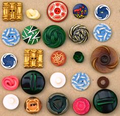 many different types of buttons on a table