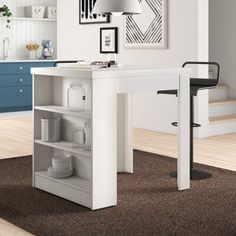 a white desk with shelves and chairs in a room