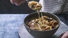 a person is spooning food out of a bowl