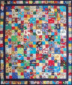 a colorful quilt with many different colors and designs on it's sides, including the center