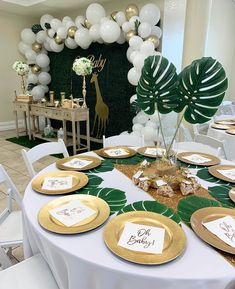 a table set up with plates and place settings for guests to sit at the tables