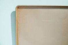 an empty wooden tray sitting on top of a table