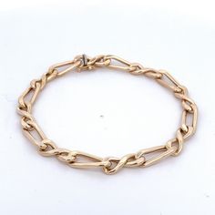 "14Kt Yellow Gold Figure Eight Curb Link Bracelet Open Link =Made in Italy. 7.75\" long with a box clasp with figure eight for safety Metal Content: 14Kt Gold Clasp: Box with figure 8 safety Measurements Length: 7.75\" Width: 1/4\" (7mm) Weight: 7.6 Grams Marked: 14kt Italy Condition: Excellent Each piece is thoroughly examined and refinished as needed by our professional jewelers, tested to guarantee metal content, graded by our in-house GIA (Gemological Institute of America) Graduate Gemologis Formal Box Chain Bracelet With Oval Links, Timeless Link Chain Bracelet With Box Clasp, Classic Link Bracelets With Box Clasp, Modern Formal Chain Bracelet With Box Clasp, Timeless Link Bracelets With Box Clasp, Luxury Link Chain Bracelet With Box Clasp, Formal Link Bracelets With Box Clasp, Formal Link Bracelet With Box Clasp, Formal Gold Oval Link Chain Bracelet