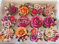 cupcakes decorated with flowers and the words happy birthday