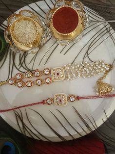 This Raksha Bandhan, show immense love to your brother with these handcrafted Rakhis. These rakhis are gold-plated and embellished with Kundan, beads, pearls, and stones. Material: Skin Friendly Metal Alloy Cooking Chocolate