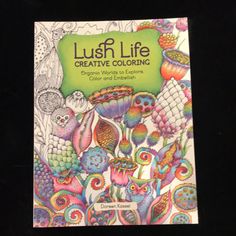 an adult coloring book with lots of colorful flowers and owls on the cover, which reads lush