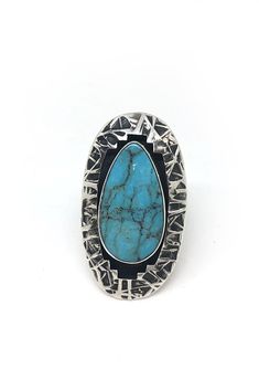 Everett and Mary Teller of Arizona are known for their innovative designs. Mary made her own silver stamp to create the unusual woven design of this oval ring. A stunning teardrop of American Turquoise is bezel set in the ring and the unique design is overlaid onto the top of the ring. Additional oxidation on the band gives this ring a very unique look Hallmarked "EMT" and stamped sterling. Turquoise Jewelry Necklace, Silver Eagle, Silver Eagles, American Turquoise, Oval Ring, Oval Rings, Woven Design, Jewelry Necklace, Turquoise Jewelry