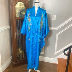 A Beautiful Chinese Silk Robe With Vibrant Hand Embroidery Depicting The Dragon And Phoenix. The Outer Shell Is Gorgeous Liquid Blue Silk And Is Lined In A Softer, Tissue Silk. It Has Original Sash Tie Belt. Never Worn!! Blue Silk Robe, Long Multicolor Silk Kimono, Blue Silk Long Sleeve Kimono, Traditional Embroidered Silk Kimono, Vintage Multicolor Silk Kimono, Chinese Silk, Silk Robe, Silk Kimono, Vintage Kimono