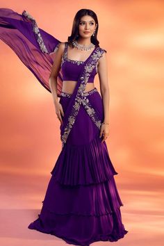 Purple pre-draped layered lehenga saree, with attached cancan, silver floral embroidery on the drape. Comes with floral embroidered padded blouse.
Components: 2
Pattern: Embroidered
Type Of Work: Floral
Neckline: Square
Sleeve Type: Sleeveless
Fabric: Georgette
Color: Purple
Other Details: 
Attached lining
Approx. product weight: 1-2 Kgs
Occasion: Destination Wedding - Aza Fashions Drape Lehenga, Sari Lehenga, Lehenga Designs Simple, Gaun Fashion, Saree Designs Party Wear, Indian Dresses Traditional, Traditional Indian Outfits, Indian Bridal Outfits, Lehenga Saree